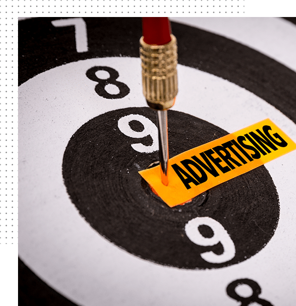 Advertising concept. A dart hits a bullseye with tag saying advertising.