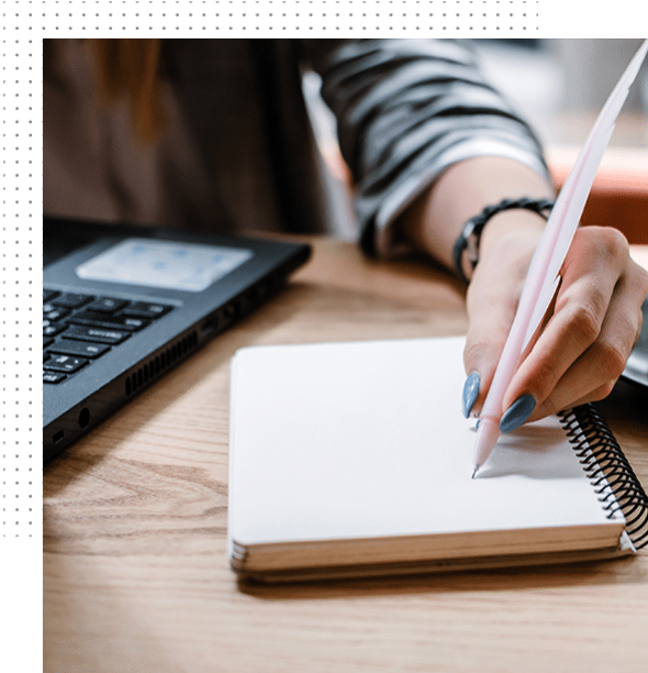Copywriting concept. A woman is writing in her notebook.
