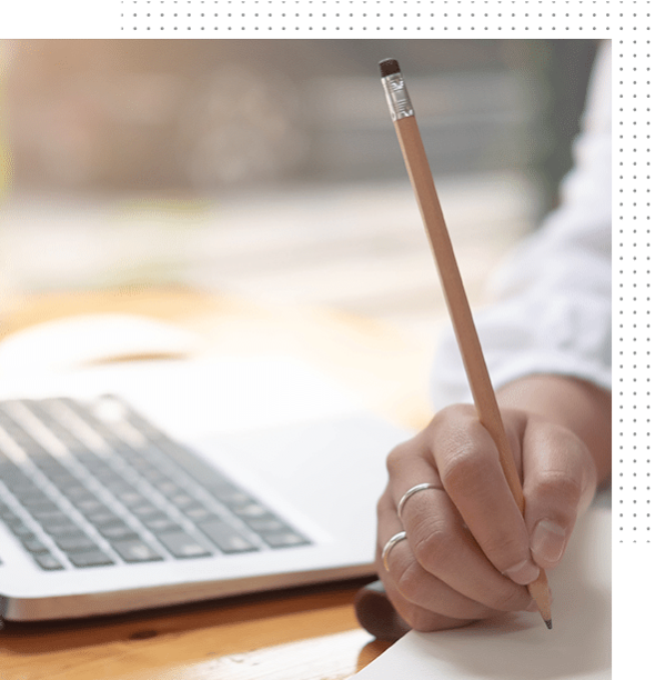 Copywriting concept. A person is writing with a pencil.